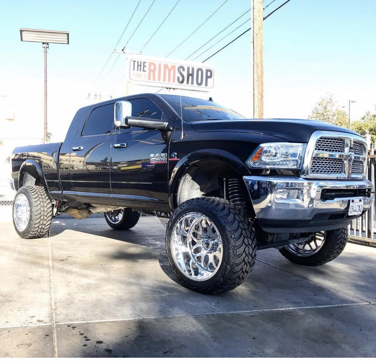 Black Ram 2500 truck with new wheels