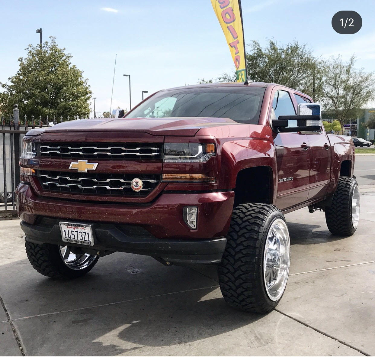 Maroon Chevy Silverado with new wheels
