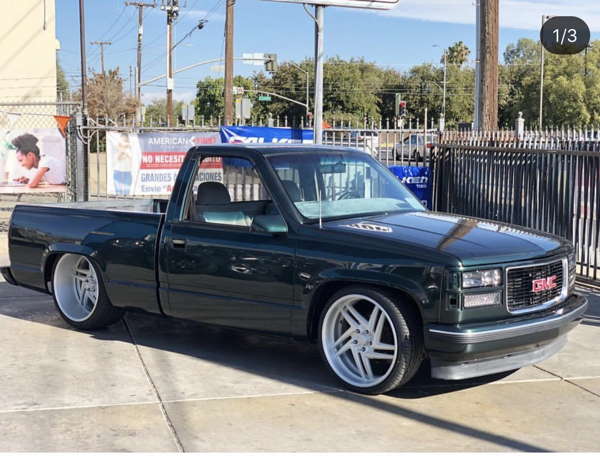 Low GMC truck with custom wheels